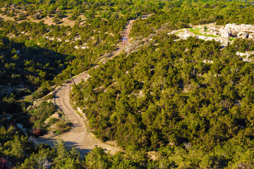 track in countryside field with rolled roads on one side, top view