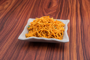 murukku or traditional indian snack chakli and chakali on background.