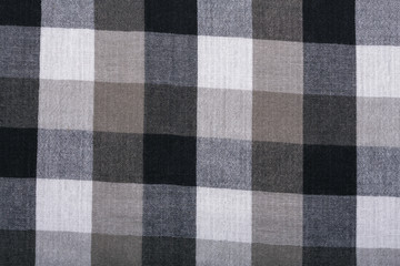 The texture of the cotton fabric. The fabric in black and white squares. The structure of the fabric. Fashion. Style. Square pattern. The pattern for textiles. Fashion Design and House Interior Design