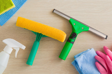 Professional window washing equipment. Early spring windows cleaning. Maid cleans window.