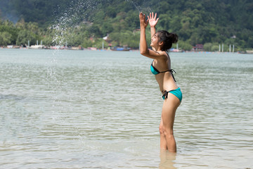 Beautiful young girl on tropical island beach