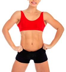 Fototapeta na wymiar Fitness woman posing against a white background