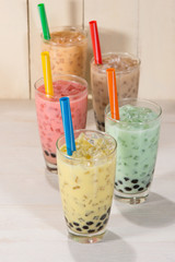 Boba / Bubble tea. Homemade Various Milk Tea with Pearls on wooden table.