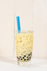 Boba / Bubble tea. Homemade Milk Tea with Pearls on wooden table.
