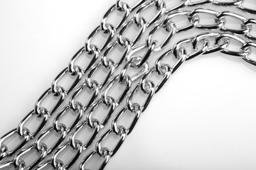 Chain heap - abstract metal background. Collection silver jewelry chains on an isolated black...