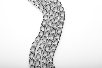 Chain heap - abstract metal background. Collection silver jewelry chains on an isolated black...