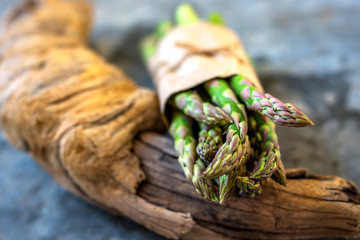 Asparagus on rustic wooden background