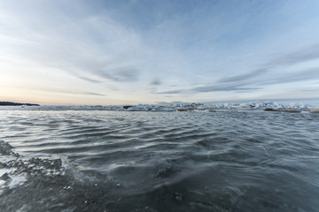 Winter landscape. Sea covered blocks of ice.