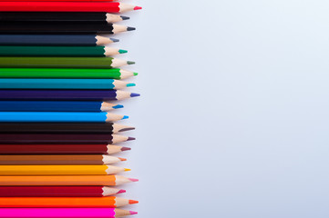 Colorful bright pencils on white background