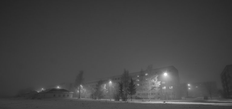 Fototapeta Night urban landscape with fog. Winter landscape.