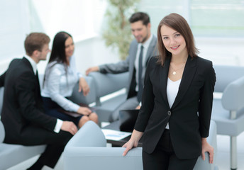 Group of young business people gathered together discussing crea