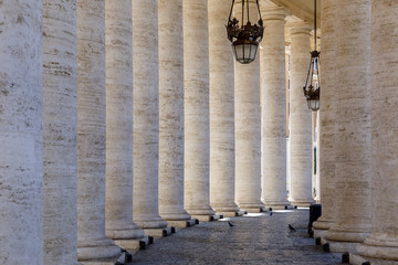Passage between the columns in St. Peter's Square in the Vatican.Roma.Italy