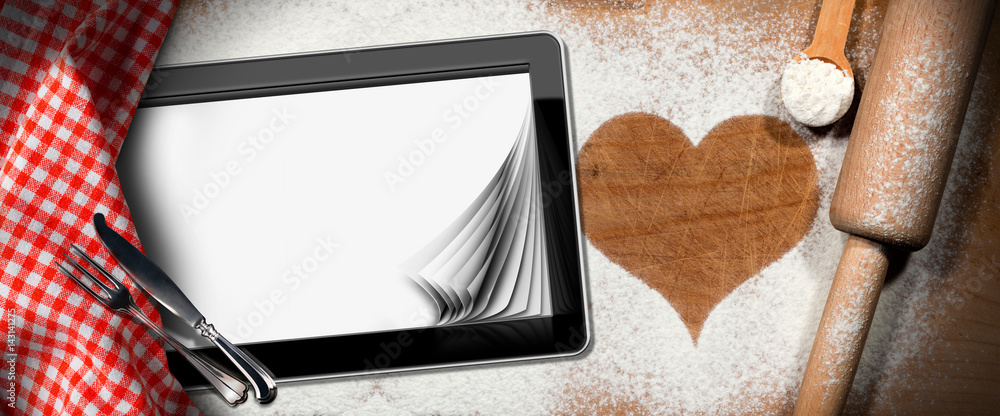 Aufkleber baking background with a heart of flour and a tablet computer with blank pages