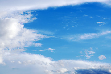Naklejka na ściany i meble Blue sky with white clouds. Nature. Meteorology.