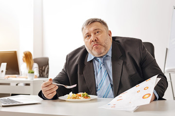 Hungry distressed worker looking overwhelmed