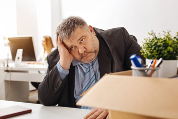 Emotional chubby guy being sad about his dismissal