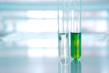 green and water of two test tube in science laboratory