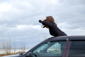 young girl looking through binoculars