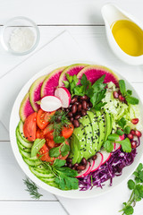 vegan lunch bowl. Avocado, red bean, tomato, cucumber, red cabbage  and watermelon radish  vegetables salad. healhty food