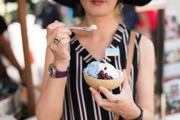 woman hold a coconut ice