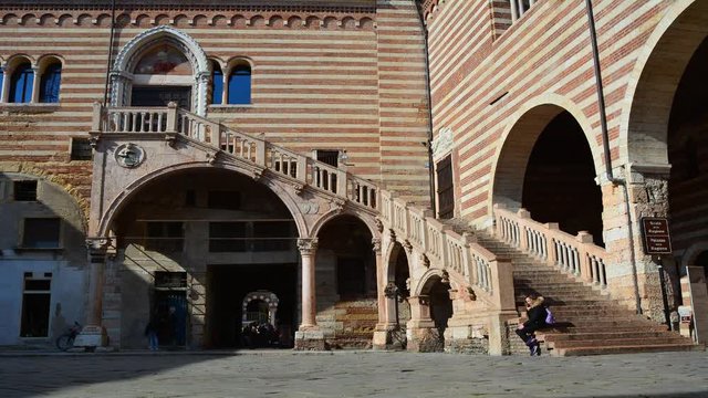 The famous marble staircase of Verona called "Scala della Ragione": time lapse with tourists on the move