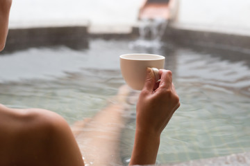 woman hold a cup of coffee