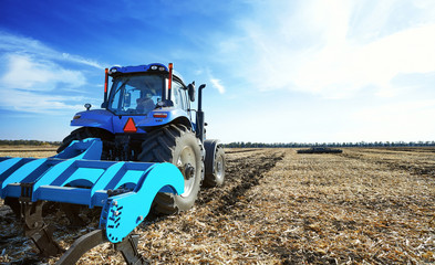 Agricultural tractor in the field