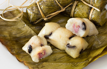 Sticky rice stuffed with bananas and black bean wrap with banana leaf thai dessert (Thai name  Kao Tom Mud)