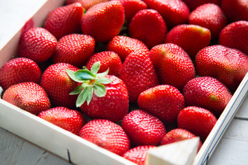Fresh strawberries in a  wooden box