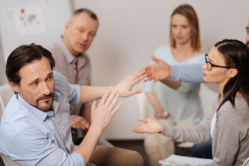 Amazed male turning away from his partners