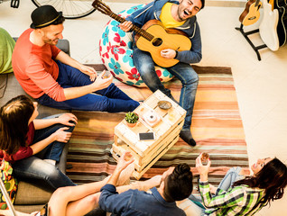 Group of trendy friends having fun in hostel living room - obrazy, fototapety, plakaty