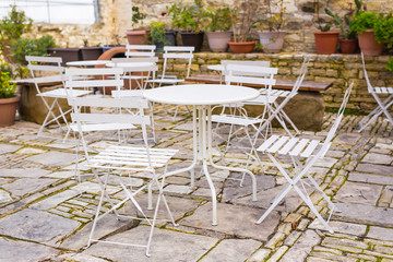 old-fashioned Cafe terrace with tables and chairs