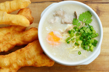 Pork congee with deep-fried dough stick.
Rice porridge  with liver,minced pork,egg and deep - fried dough stick .