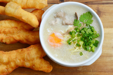 Pork congee with deep-fried dough stick.
Rice porridge  with liver,minced pork,egg and deep - fried dough stick .