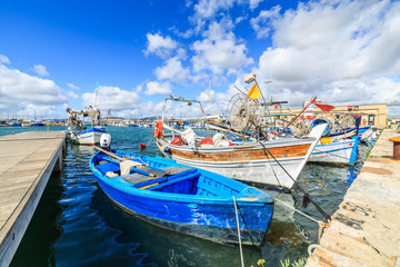 Fototapeta na wymiar Boats in a port of Alghero, Sardinia, Italy