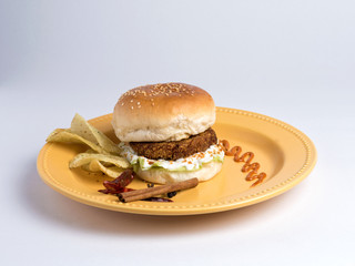 kolhapuri burger served in a plate on white background