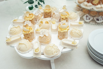 white Cakes and cupcakes on vintage white dish