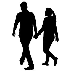 Silhouette man and woman walking hand in hand