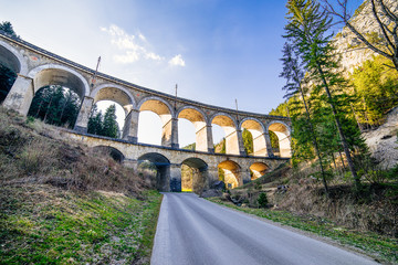 panaroama of a rail viaduct - train bridge over a valley - Semmering Bahn - unesco world heritage - 
