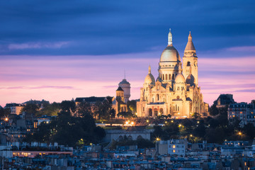 Fototapeta na wymiar The Basilica of the Sacred Heart (Sacré-Cœur Basilica) during the Blue Hour. Montmartre, Paris, France