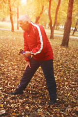Senior man exercising in the park.