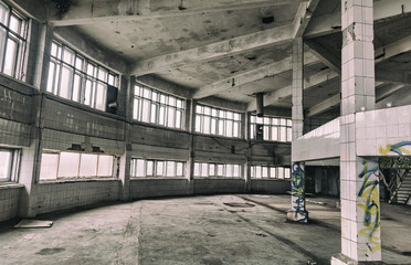 Inside an abandoned deserted cluttered industrial building