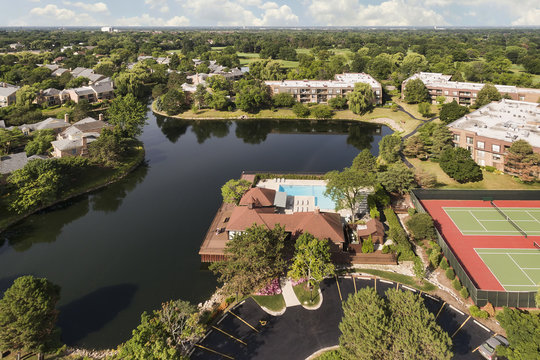 Aerial view of suburban community with lake