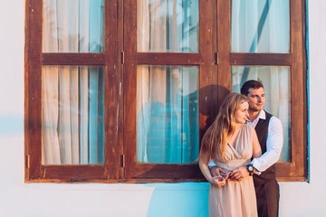 Fototapeta premium lovely couple stay near beach hut around ocean or sea palms and sand.