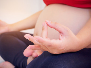 Obraz na płótnie Canvas pregnant woman doing yoga