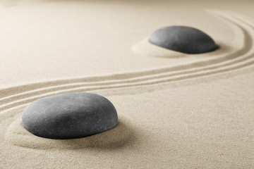 Fototapeta na wymiar spiritual zen meditation stones in sand. Background for spa wellness buddhism and yoga...