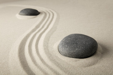 Fototapeta na wymiar zen stone sand texture background. Spa wellness or yoga theme. Concept for relaxation, meditation harmony, spirituality and purity...