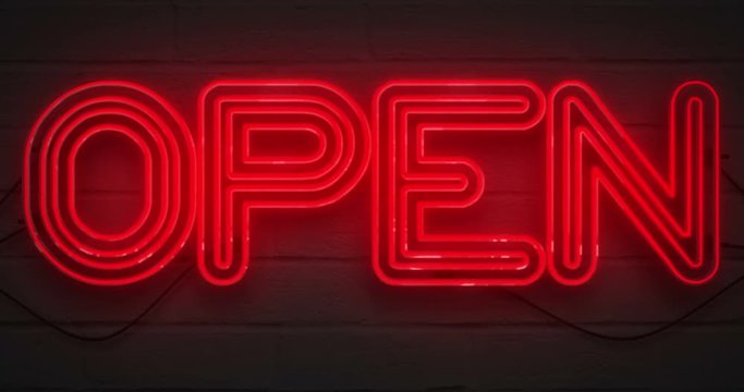 flickering blinking red neon sign on brick wall background, open shop bar sign concept