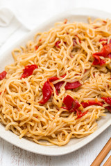 noodles with vegetables on white dish