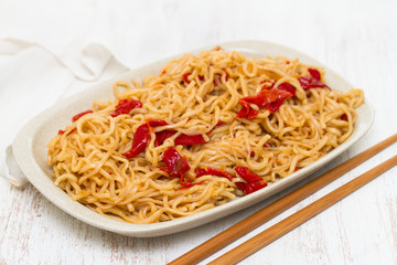noodles with vegetables on white dish